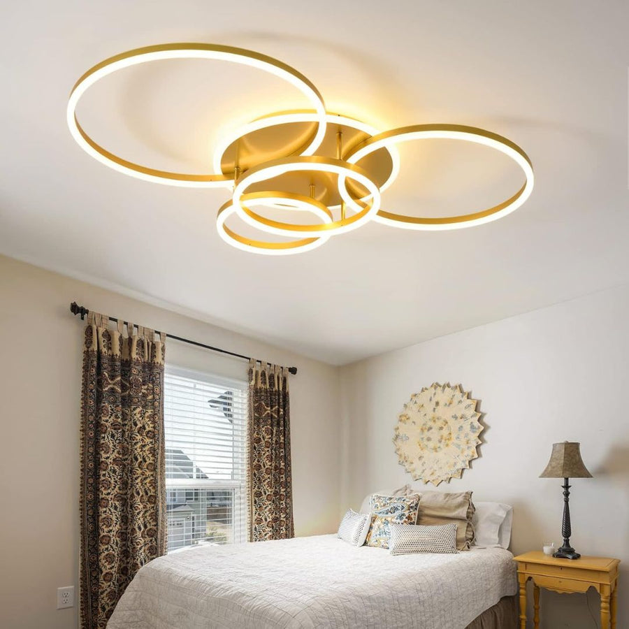 LED luster s diaľkovým ovládaním DARIO, 4 kruhy, 112W, teplé/studené/neutrálne svetlo, stmievateľné, zlaté