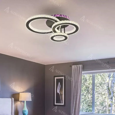 LED luster s diaľkovým ovládaním a krištáľom LEOCADIA RGB 134W, 3 kruhy, studené/teplé/neutrálne svetlo, stmievateľné, čierny